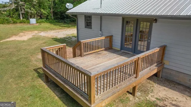 a view of backyard with deck and oven