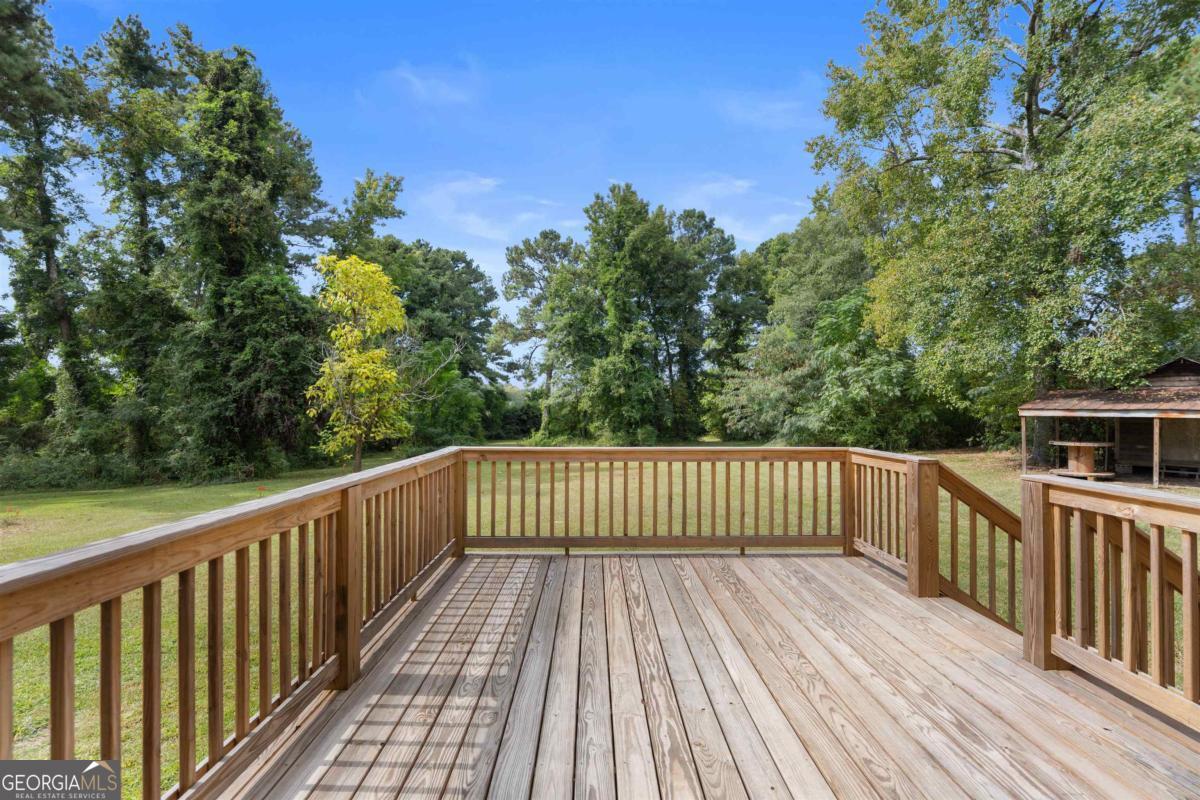 1251 Brickhouse Road Greensboro, GA 30642 - Photo 29 of 35 a view of deck with wooden floor and fence