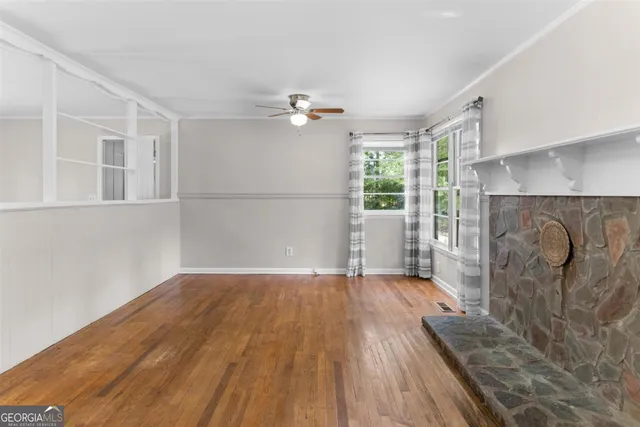 a view of livingroom with furniture wooden floor and window