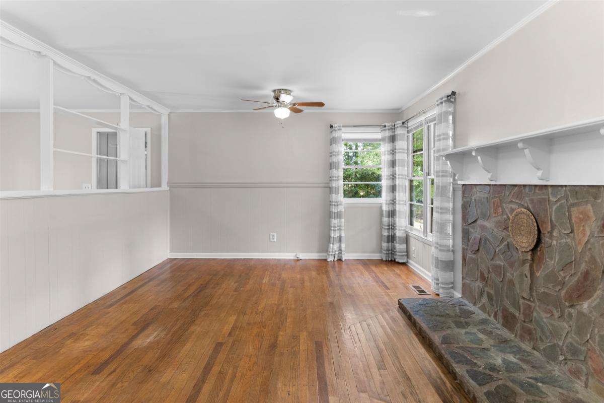 1251 Brickhouse Road Greensboro, GA 30642 - Photo 6 of 35 a view of livingroom with furniture wooden floor and window