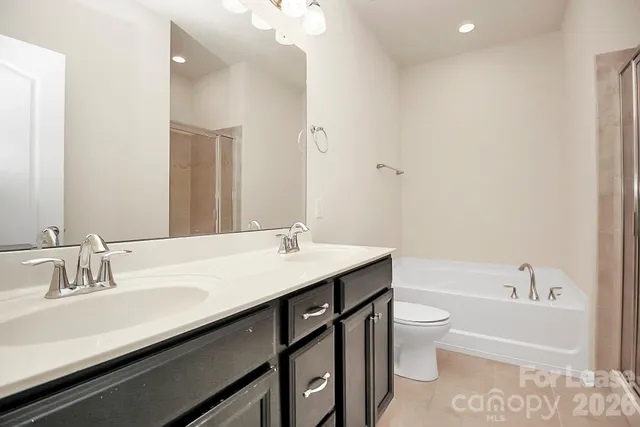 a bathroom with a sink a toilet and bathtub