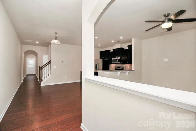 a view of living room with granite countertop furniture and fireplace