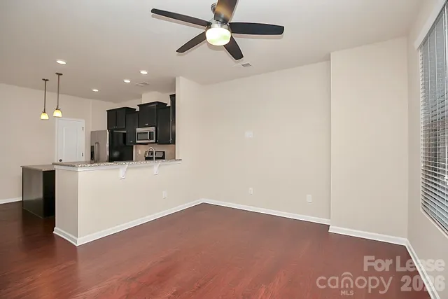 a view of a kitchen with a sink and dishwasher