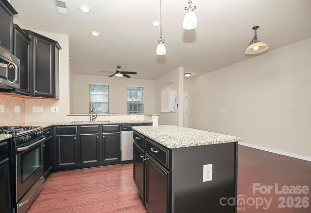 a kitchen with a sink and stove