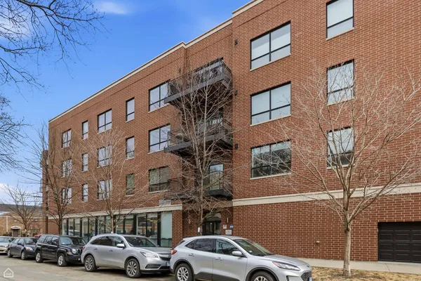 a view of a building and car parked