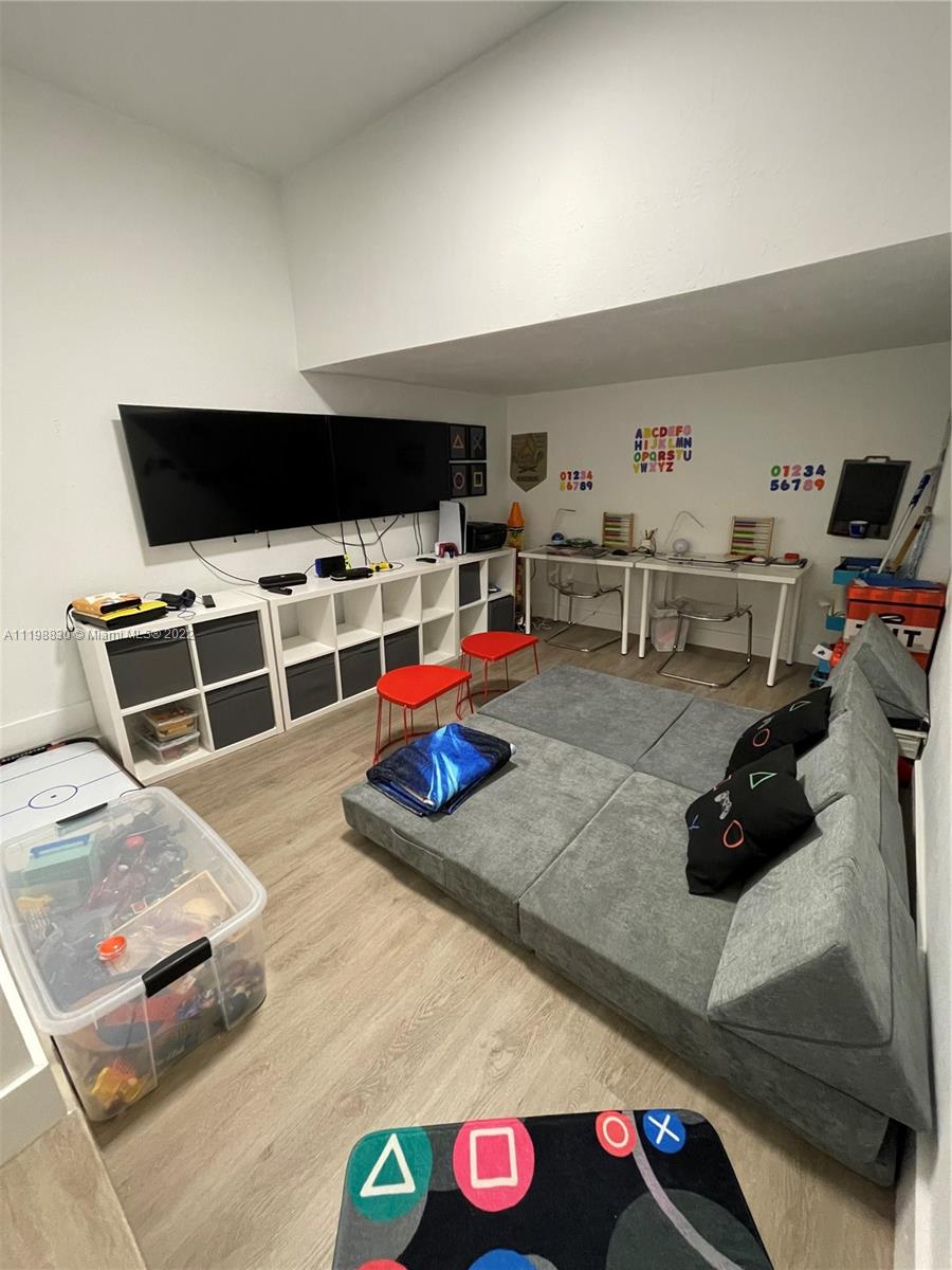 Doral Isles Doral, FL 33178 - Photo 13 of 35 a bedroom with furniture and a flat screen tv