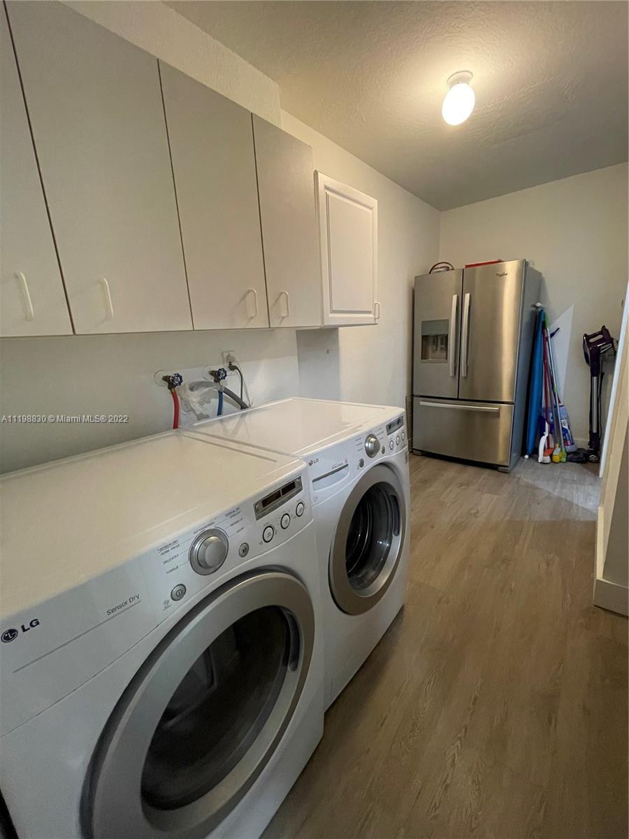 Doral Isles Doral, FL 33178 - Photo 14 of 35 a utility room with dryer and washer