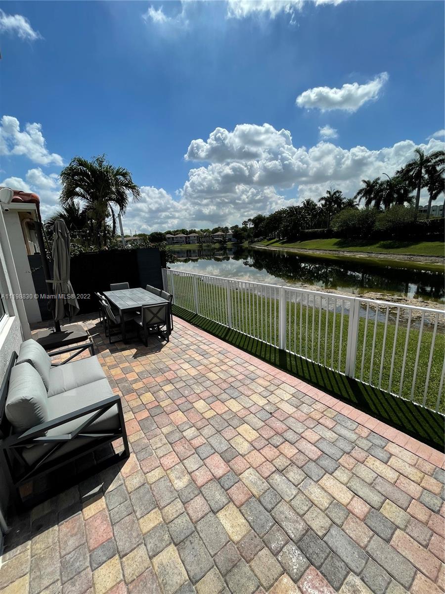 Doral Isles Doral, FL 33178 - Photo 18 of 35 a view of a terrace with chairs
