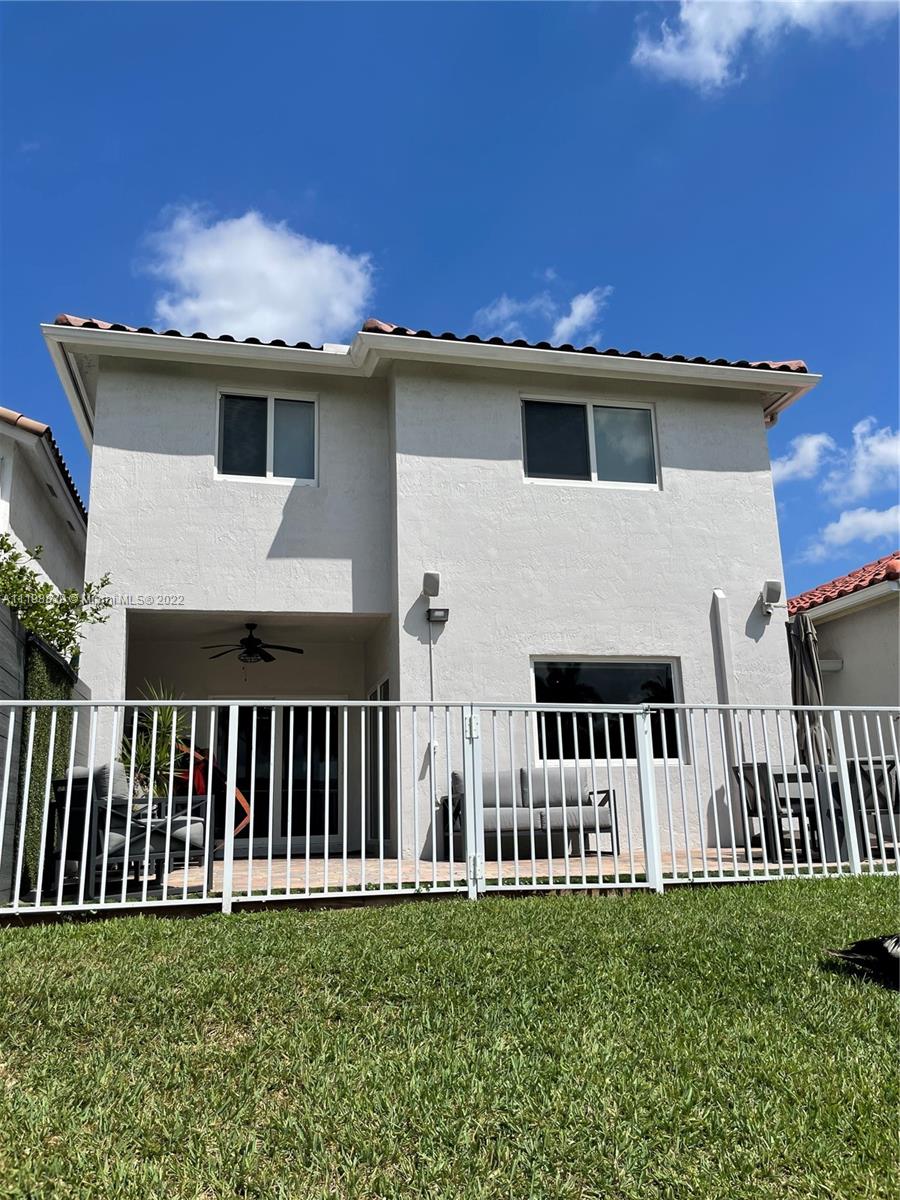 Doral Isles Doral, FL 33178 - Photo 19 of 35 a view of a house with backyard and porch