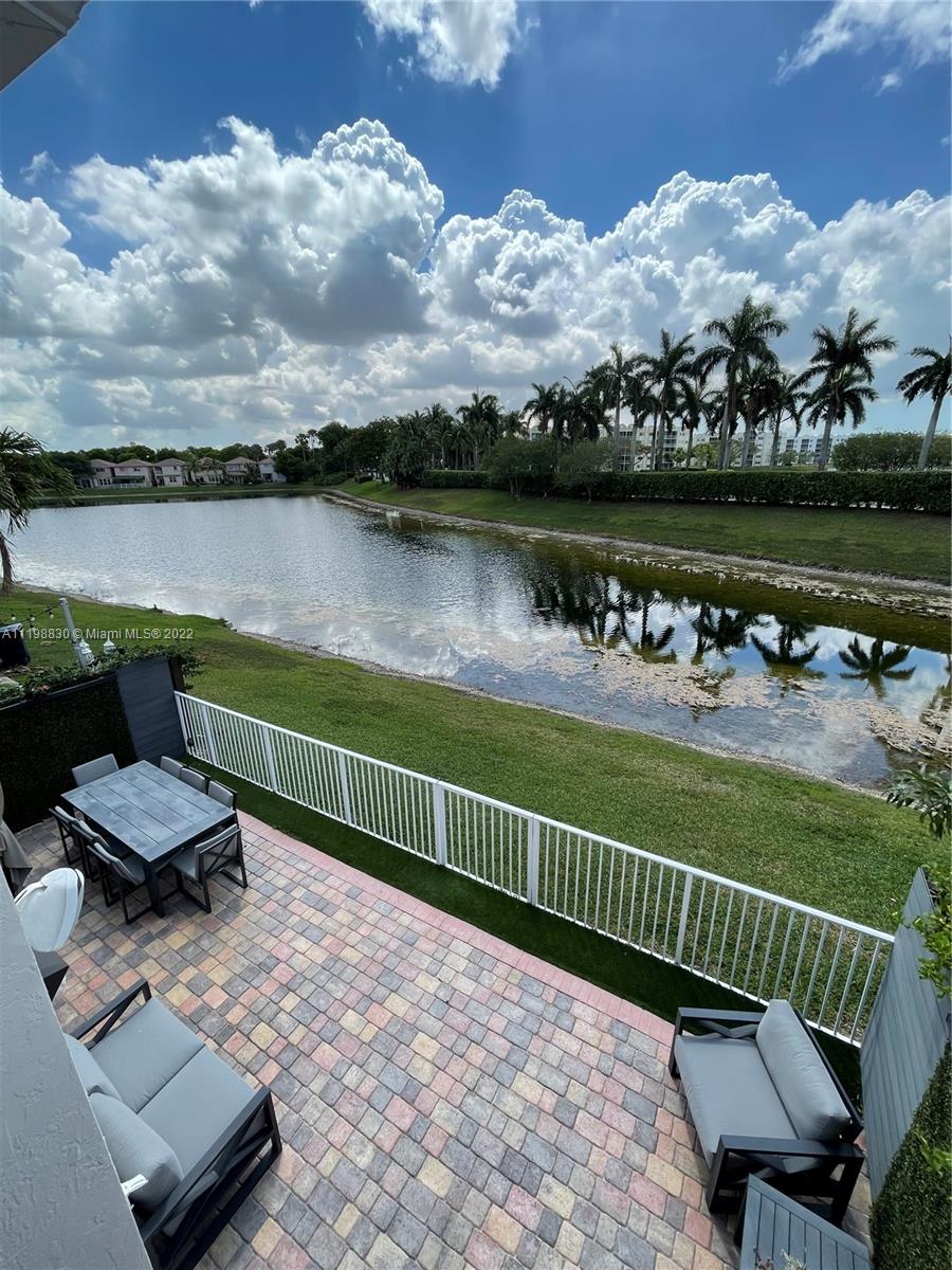 Doral Isles Doral, FL 33178 - Photo 20 of 35 an outdoor space with lounge chairs