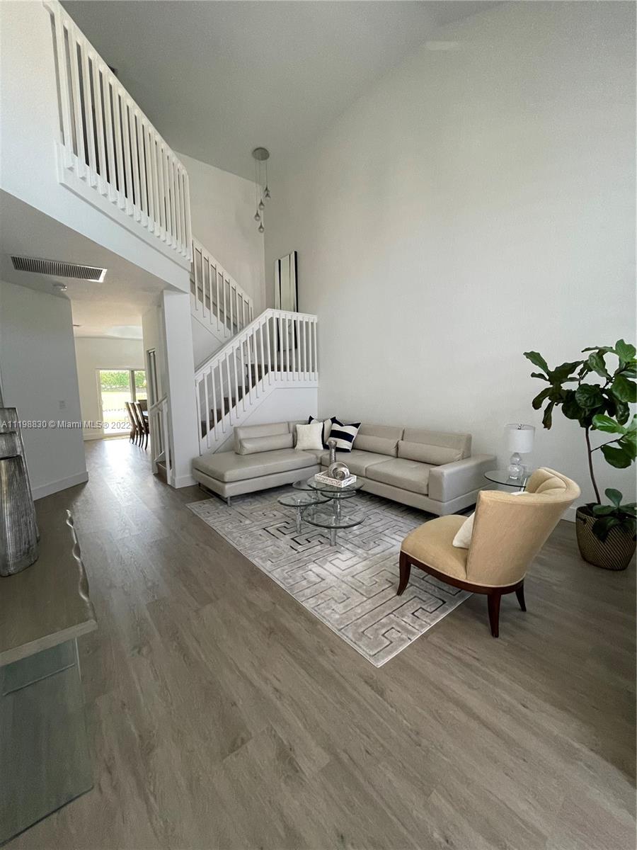 Doral Isles Doral, FL 33178 - Photo 2 of 35 a living room with furniture and wooden floor