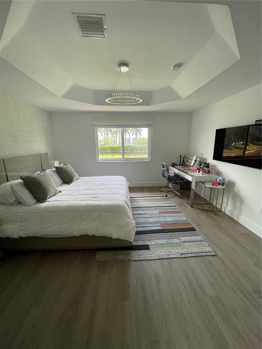 Doral Isles Doral, FL 33178 - Photo 23 of 35 a bedroom with bed and window