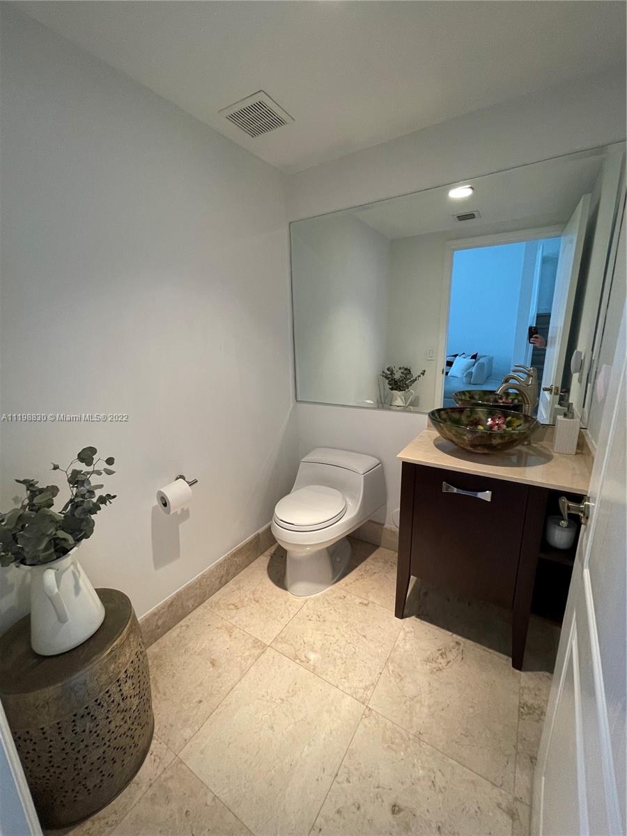 Doral Isles Doral, FL 33178 - Photo 4 of 35 a kitchen with a sink and a stove