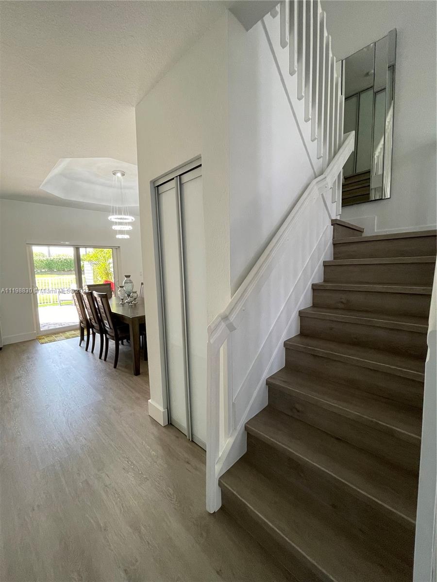 Doral Isles Doral, FL 33178 - Photo 5 of 35 a view of entryway and hall with wooden floor