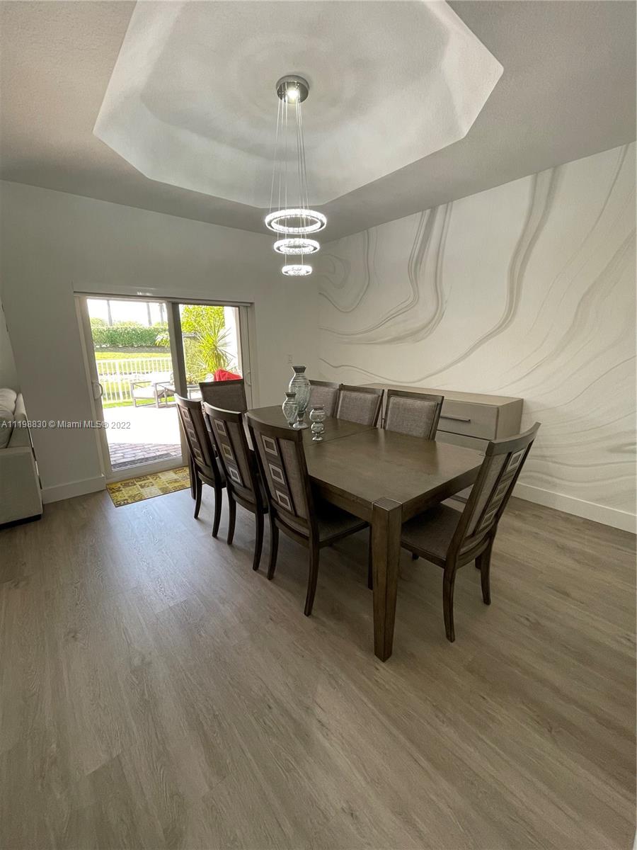 Doral Isles Doral, FL 33178 - Photo 6 of 35 a view of a dining room with furniture and window
