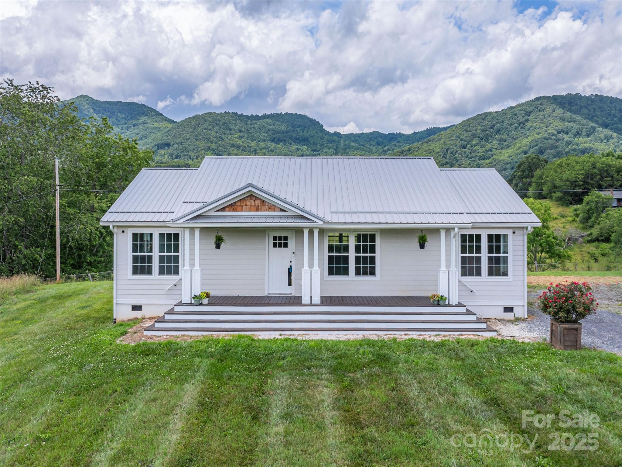 3355 Thickety Road Clyde, NC 28721 - Photo 29 of 33 a front view of a house with a yard