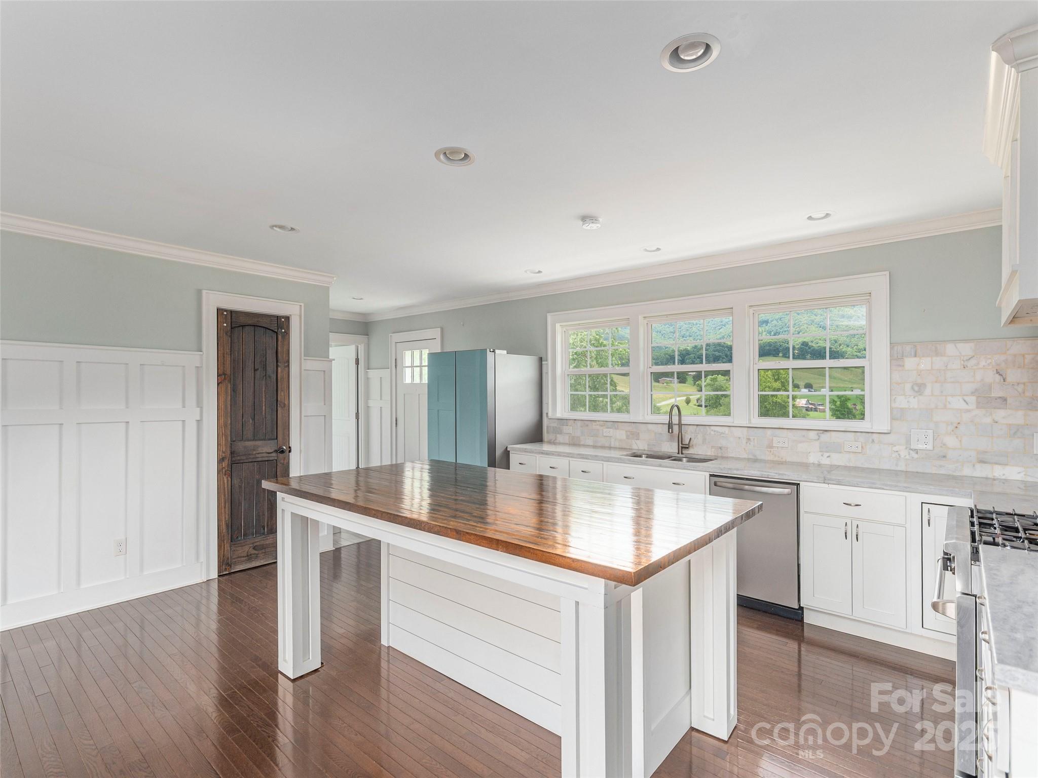 3355 Thickety Road Clyde, NC 28721 - Photo 6 of 33 a kitchen with a sink cabinets and wooden floor