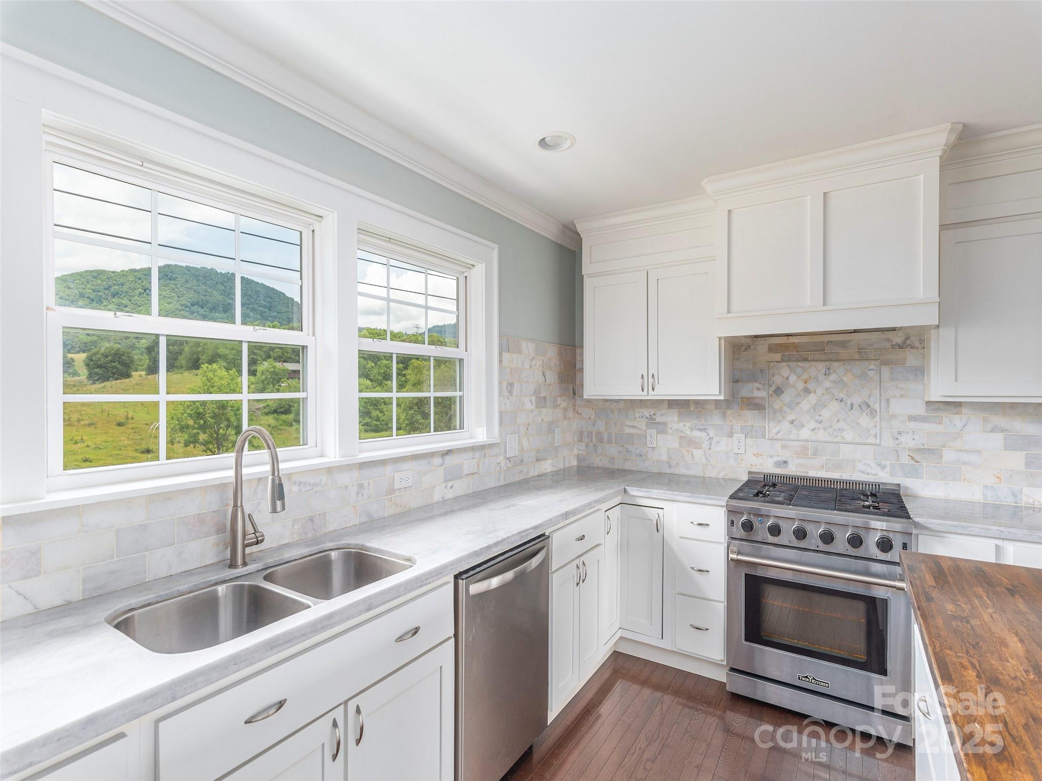3355 Thickety Road Clyde, NC 28721 - Photo 9 of 33 a kitchen with granite countertop a sink and a window