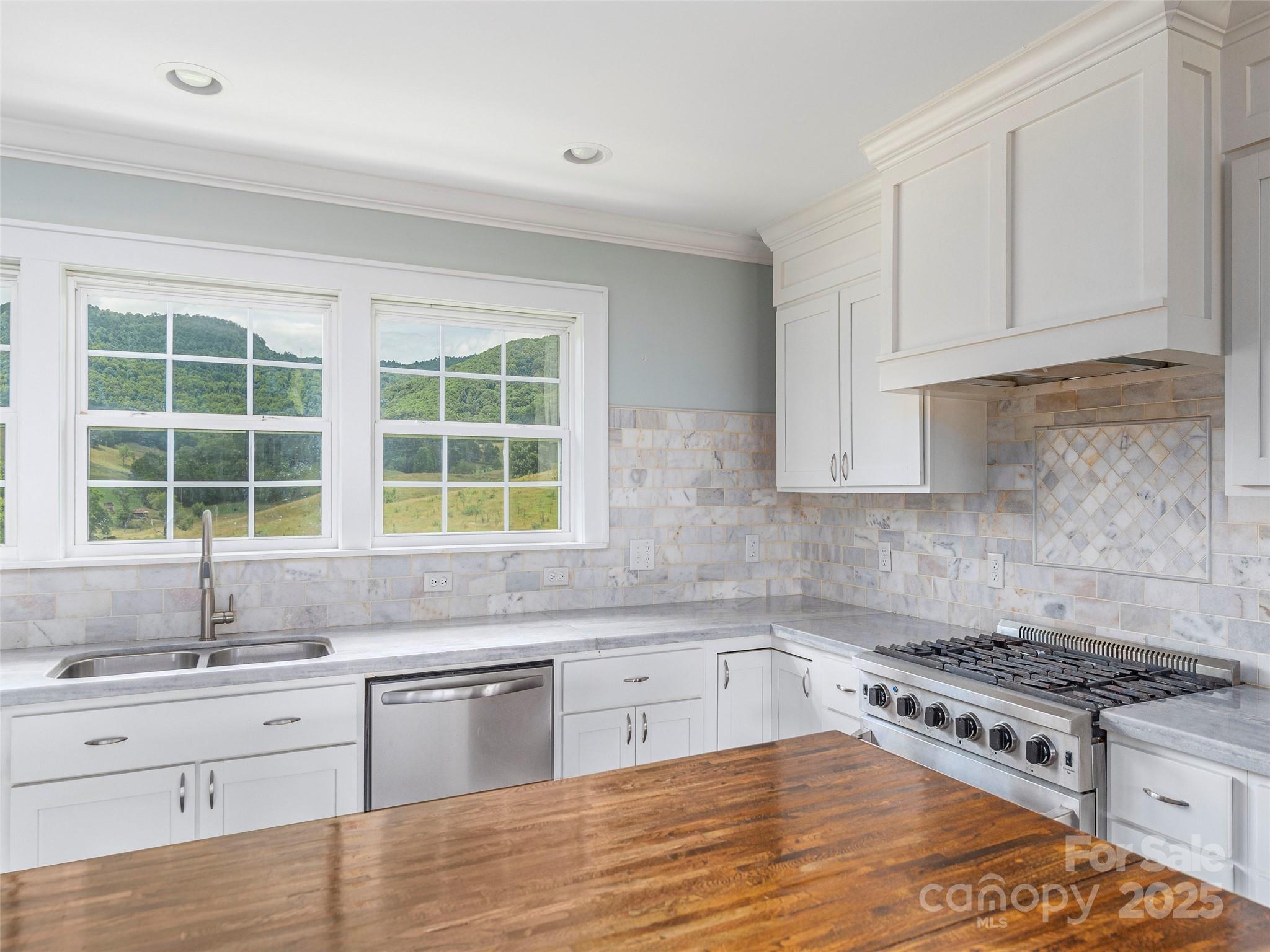 3355 Thickety Road Clyde, NC 28721 - Photo 10 of 33 a kitchen with granite countertop a stove a sink and a granite counter tops