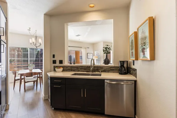 a kitchen with a sink and cabinets