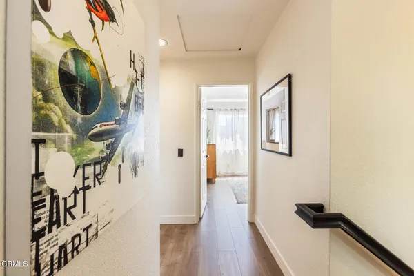 a view of a hallway with washer and dryer