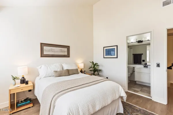 a bedroom with a bed and a view of bathroom