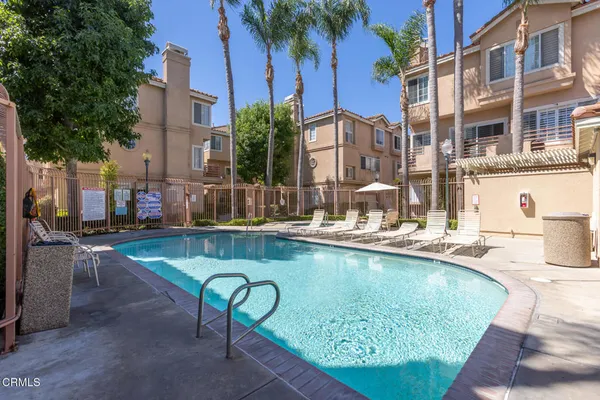 a view of swimming pool with outdoor seating