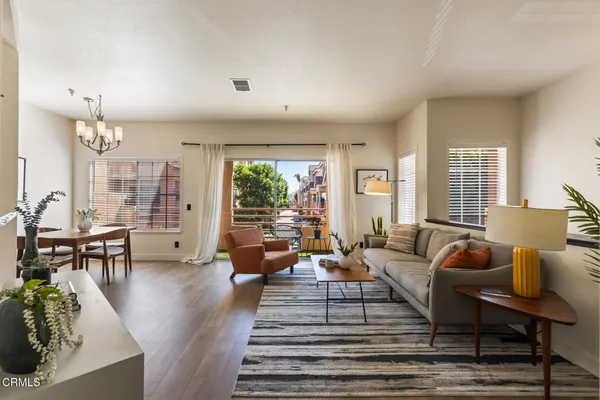 a living room with furniture and a large window