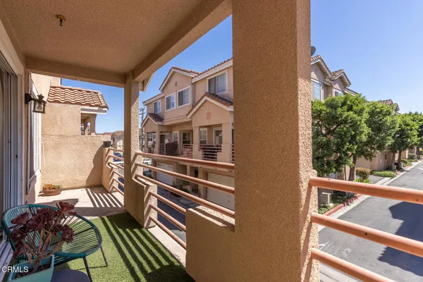 a balcony view with a large window