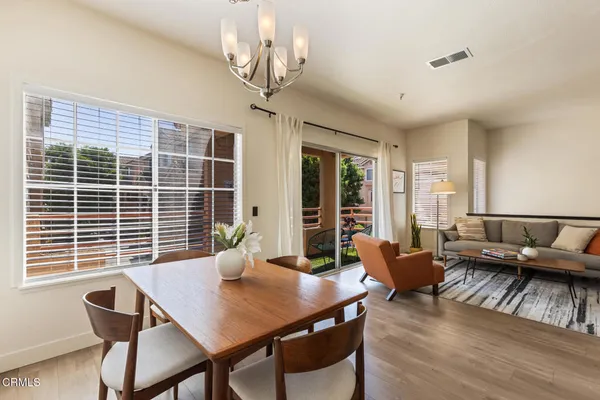 a view of a dining room with furniture window and outside view
