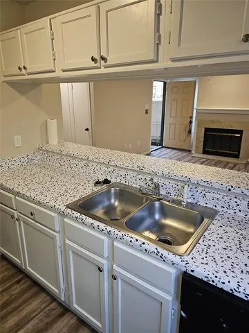 a kitchen with granite countertop a sink and granite top
