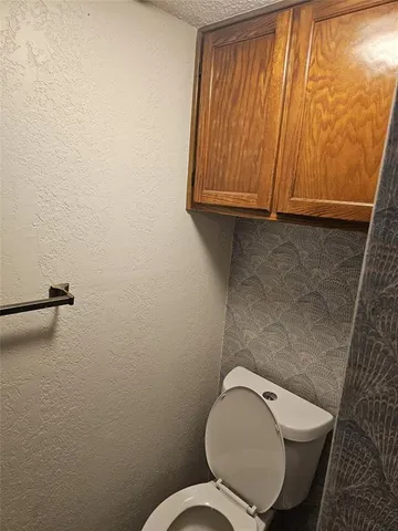 a bathroom with a toilet and a sink
