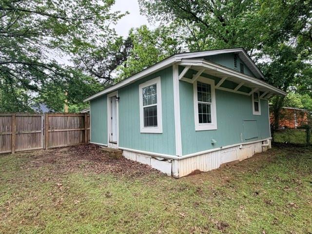 927 West Baker Street Denison, TX 75020 - Photo 13 of 14 a backyard of a house with lots of green space