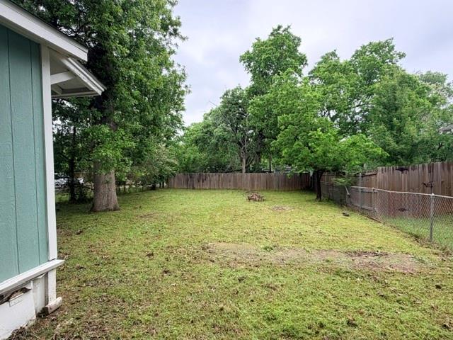 927 West Baker Street Denison, TX 75020 - Photo 14 of 14 a backyard of a house with lots of green space