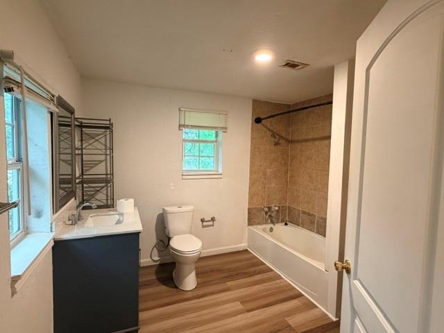 927 West Baker Street Denison, TX 75020 - Photo 6 of 14 a bathroom with a sink a toilet and shower