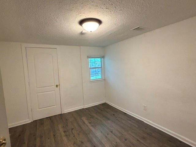 927 West Baker Street Denison, TX 75020 - Photo 7 of 14 wooden floor in an empty room