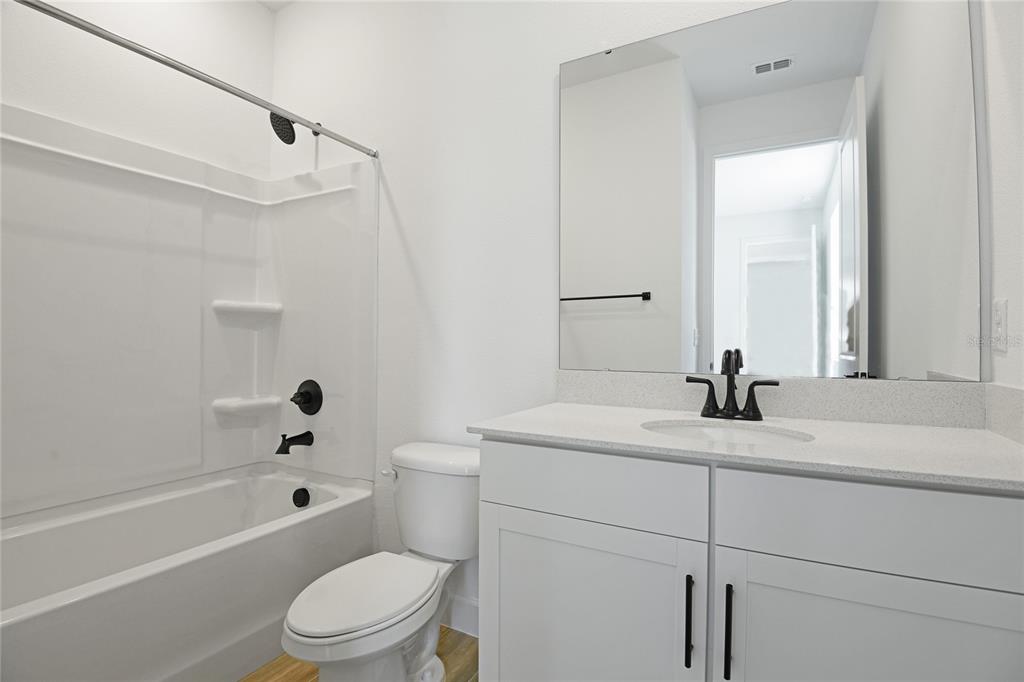 3725 Deer Rdg Drive Mount Dora, FL 32757 - Photo 13 of 23 a bathroom with a sink a toilet and a bathtub