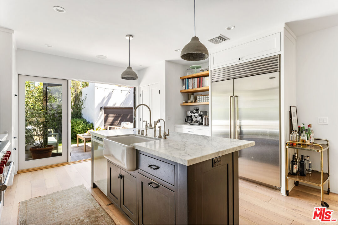 1616 Electric Avenue Venice, CA 90291 - Photo 12 of 35 a kitchen with a stove a sink and a refrigerator