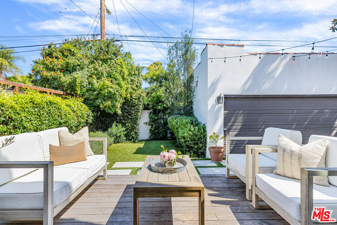 1616 Electric Avenue Venice, CA 90291 - Photo 15 of 35 a view of a patio with couches table and chairs and potted plants
