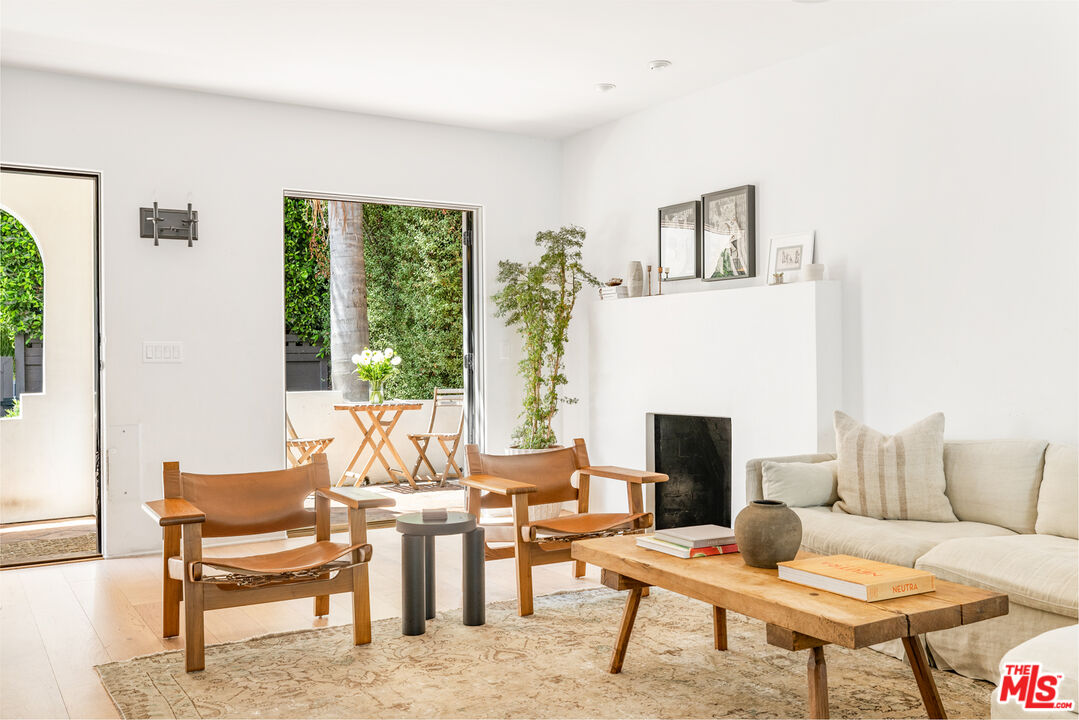 1616 Electric Avenue Venice, CA 90291 - Photo 4 of 35 a living room with furniture and a fireplace