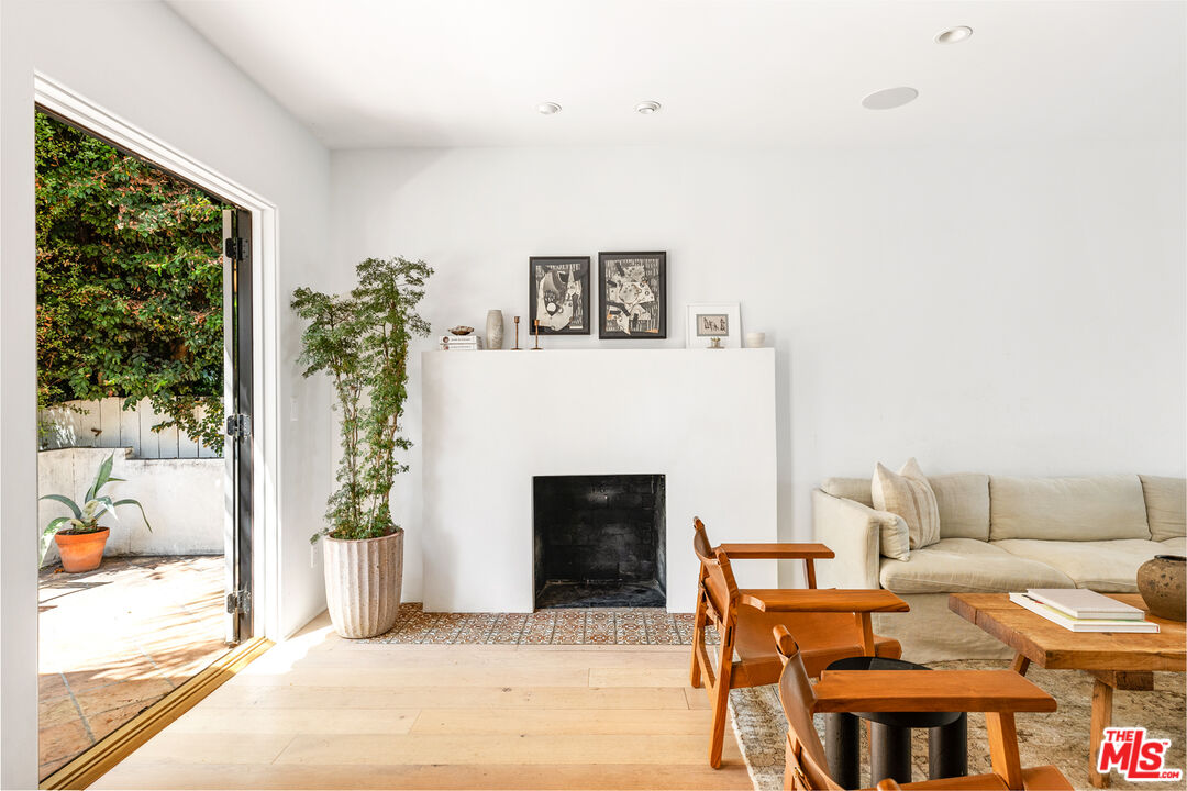 1616 Electric Avenue Venice, CA 90291 - Photo 5 of 35 a living room with furniture and a fireplace