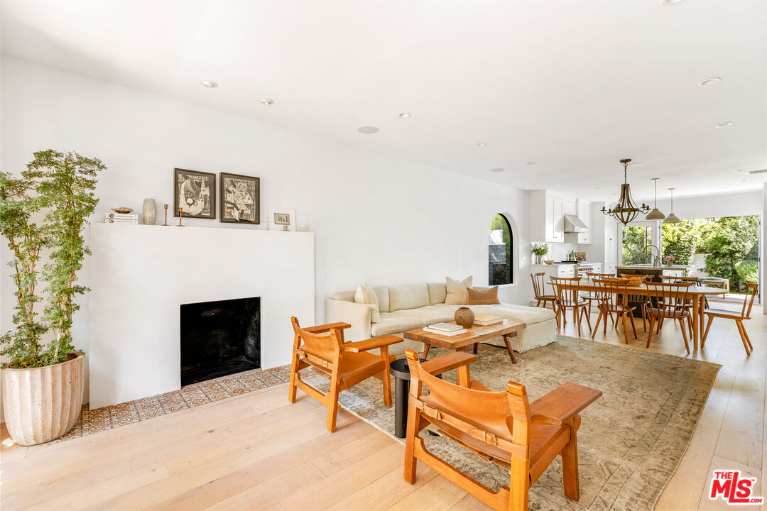 1616 Electric Avenue Venice, CA 90291 - Photo 6 of 35 a living room with furniture a fireplace and a table
