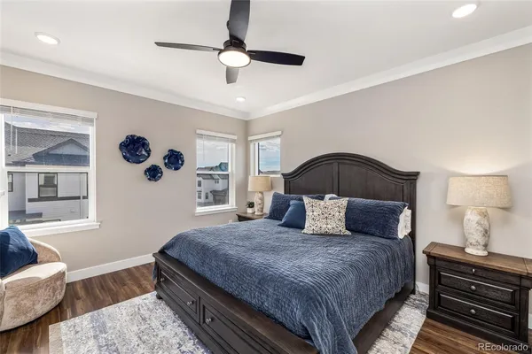 a bedroom with a bed lamp and a dresser