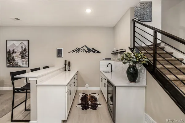 a view of a storage and utility room with washer and dryer
