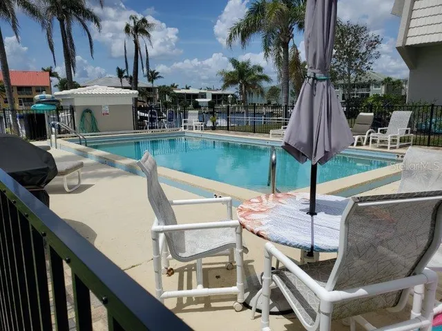 a view of a patio with swimming pool