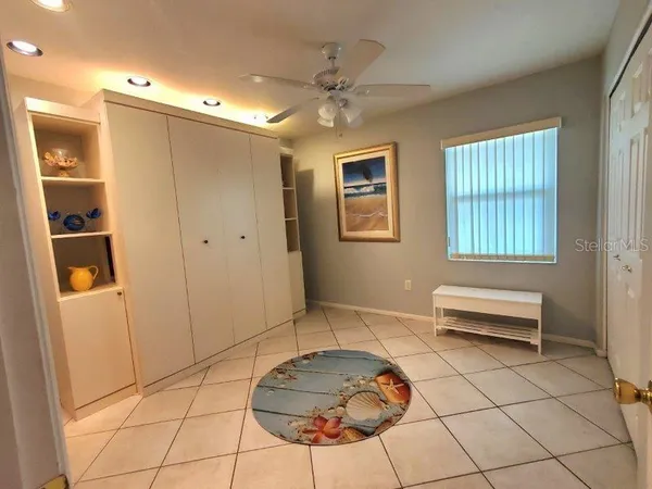 a living room with a bath tub and a window
