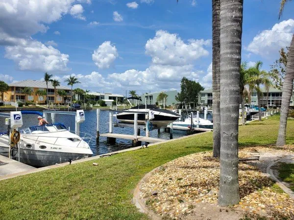 a view of a house with backyard space and sitting area