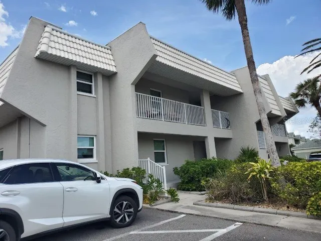 a view of a car park in front of house
