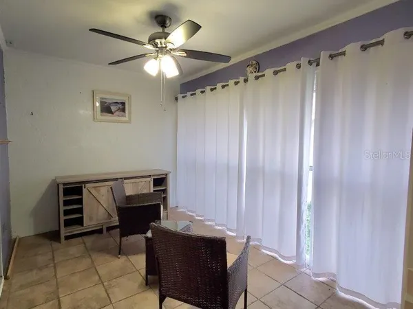 a view of room with a table and chairs