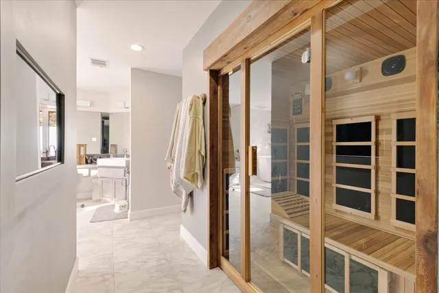 a view of a bathroom with a tub and windows